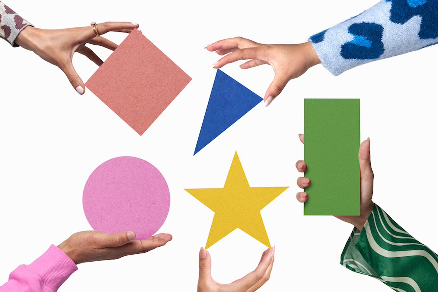 hands holding geometric shapes