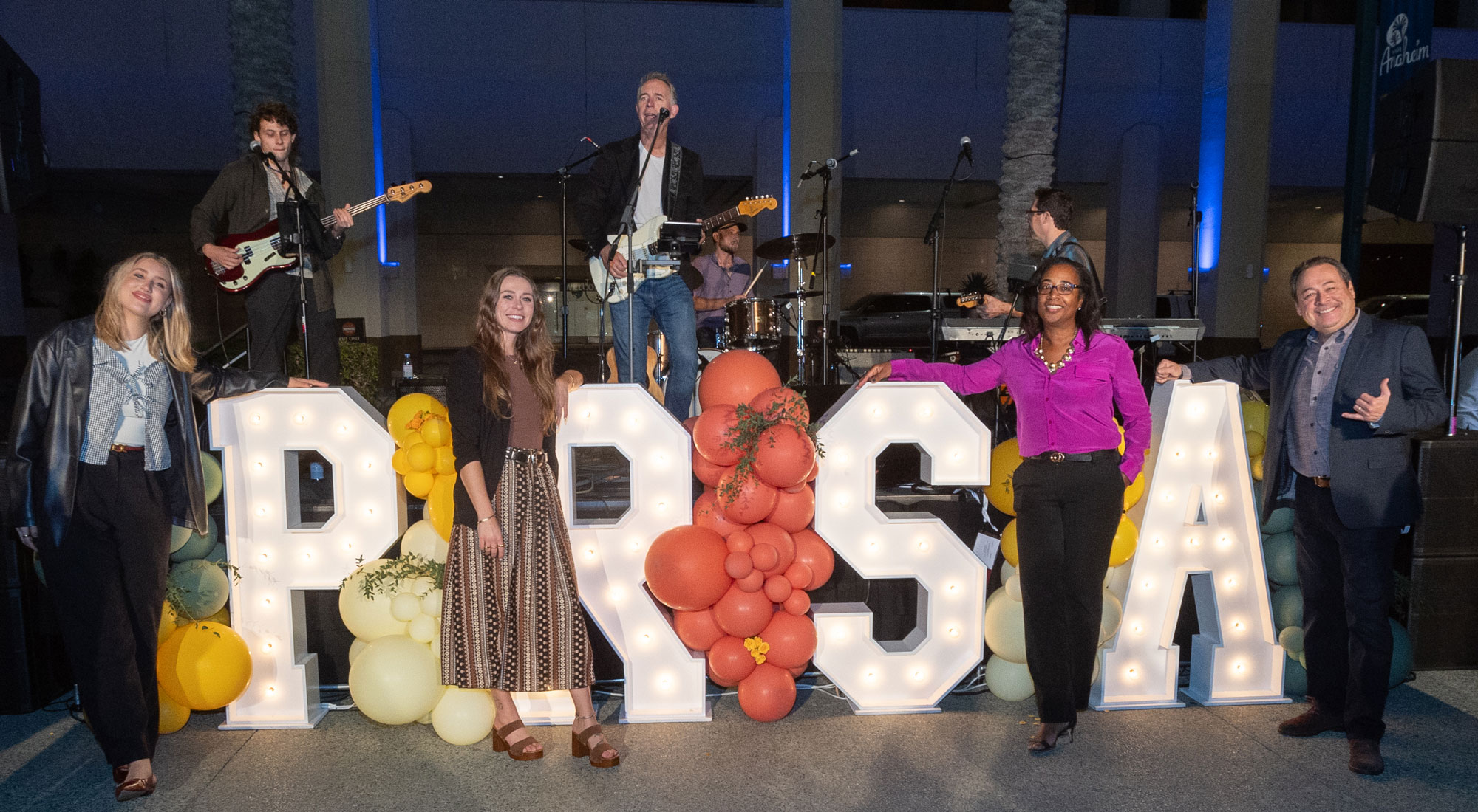 PRSA initials in lights with balloons PRSA initials in lights with balloons