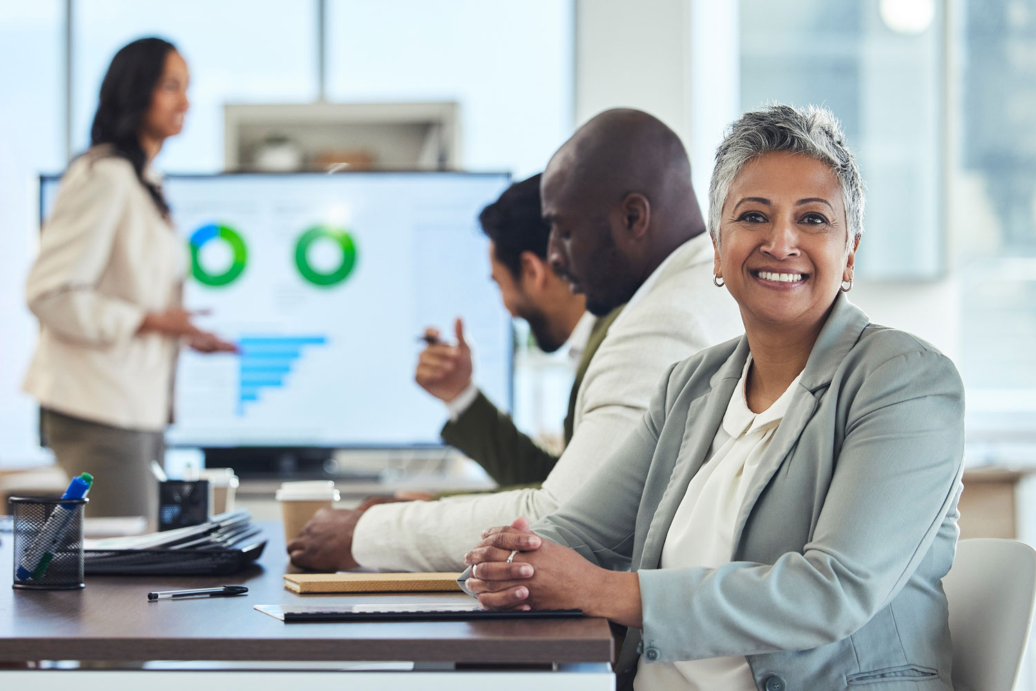 senior woman at conference table senior woman at conference table