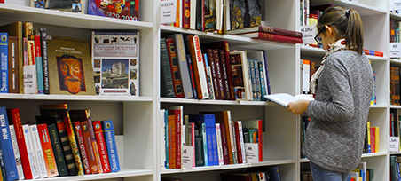 Glossary of Terms Person sorting through books for a glossary of terms.
